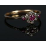 An 18ct Gold Ruby and Diamond cluster ring. Size O. Total weight: 1.7g.