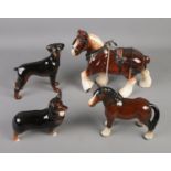 Two Beswick horses with two Beswick dogs.