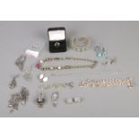 A collection of white metal costume jewellery to include one silver ring, assorted necklaces,