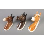 A trio of Beswick horse wall plaques; Palomino 1384, Hunter 1382 and Arab 1385.