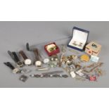 A collection of jewellery and collectables. Includes silver toothpick, costume jewellery brooches,