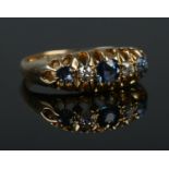 An early 20th century 18ct gold sapphire and diamond five stone ring. Size K. 2.97g.