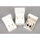 Three pairs of boxed earrings. Includes two pairs of Rachel Ashwell silver gilt and coloured cubic