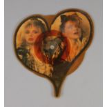 A Madonna Into The Groove heart shaped vinyl picture disc.