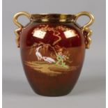 A Carlton Ware twin handled urn in the Rouge Royale pattern. 10.5cm tall. Slight gilt wear. No chips