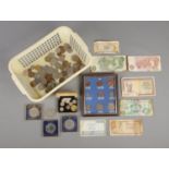 A box of coins and banknotes. Includes silver Victorian examples, etc.