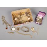 A quantity of vintage jewellery. Includes fob on chain, rings, watches, brooches, small collection