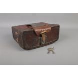 A Twentieth Century leather pouch, possibly cartridge case, with belt hoop and lockable top. Stamped