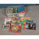 A box of miscellaneous to include several Giles jigsaw puzzles, assorted vinyl including Elvis,