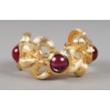 A Givenchy gold plated bracelet with red coloured cabochon stones. Total length 18.5cm.