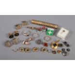 A collection of assorted costume jewellery, to include bowling tie pin, coin cufflinks, pin badges