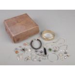 A Garrard & Co box with contents of silver and white metal jewellery. Includes bangle (40.52g),
