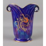 A Crown Devon blue lustre vase depicting oriental style dragon. 17.5cm tall.