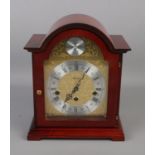 A Tempus Fugit eight day mantel clock. With key. Overall good condition. Working order.
