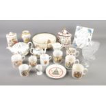A box of commemorative items including glassware, mugs and plates as well as other ceramics by