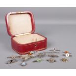 An L. Mannelli red leather jewellery box containing fourteen vintage and Victorian silver