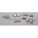 Seven pairs of silver earrings, to include large pointed and turquoise set examples. Total weight:
