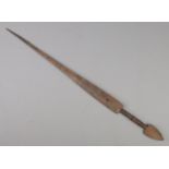 An antique African tribal sword with leather wrapped grip. Length of blade 55cm.