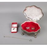 A white metal jewellery box with contents of silver jewellery including signet ring, necklace,