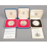 Three silver proof crowns, in Royal Mint display cases. To include silver jubilee and the marriage