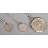 Three coins on silver chains. Comprising of 1887 shilling, 1917 quarter dollar and 1953 five