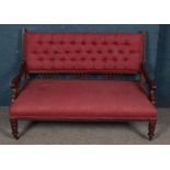 A Victorian mahogany parlour sofa with deep button upholstered back. Height 88cm, Width 125cm, Depth