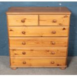 A modern pine chest of drawers with two small over four large drawers. Height 92cm Width 92cm