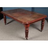 A Victorian carved mahogany wind out dining table. (72cm x 124cm x 182cm) Missing winder.