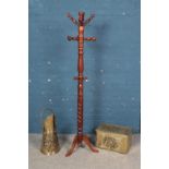 A Victorian style mahogany coat and hat stand on triform base with brass coal scuttle and box