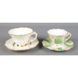 Two Primrose Leaf Rockingham teacups and saucers featuring decorative twisted handles. Pattern