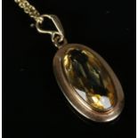 A 9ct gold citrine pendant on chain. Total weight 5.6g.