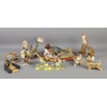 A collection of ceramic and resin animal figure groups. To include examples by Country Artists and