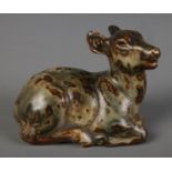 A Royal Copenhagen stoneware figure formed as a recumbent deer. Possibly by Knud Kyhn. (7cm x 10cm)