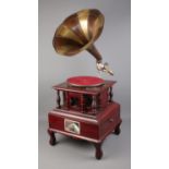 A His Master's Voice reproduction gramophone with decorative base featuring singular drawer.
