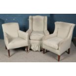 Three arm chairs with matching upholstery. Includes two wing back examples.
