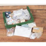 A large box of loose mostly British stamps most bearing Queen Elizabeth II.