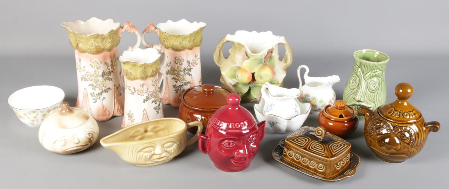 A collection of ceramics. Includes Sylvac food jars, Victorian graduated jugs, etc.