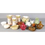 A collection of ceramics. Includes Sylvac food jars, Victorian graduated jugs, etc.