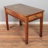 A 1940's teachers desk in oak with brass plated ink wells and glass inserts, draw to either side