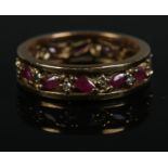 A 9ct gold ruby and diamond eternity ring. Size Q, 4.5g.