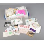 A box of assorted world stamps and first day covers to include Argentina, The Virgin Islands,