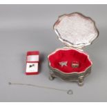 A white metal jewellery box, stamped with 'Dieu et Mon Droit' with contents of silver jewellery