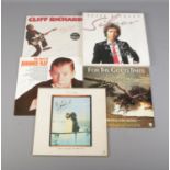 A collection of five signed vinyl records to include two from Cliff Richard, Perry Como, David