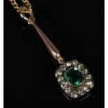 A 9ct gold pendant on chain set with central green paste stone. Total weight 4g.