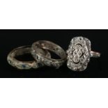 Three vintage rings including 9ct gold marcasite eternity ring. One ring has previously been cut.