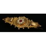 A 9ct gold Victorian bar brooch set with central spinel surrounded by seed pearls. Total weight 3.