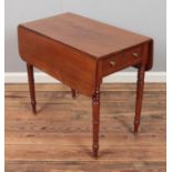 A Victorian mahogany Pembroke table with brass feet. Hx67cm Wx76cm Dx44cm