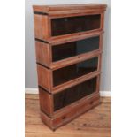 An oak Globe Wernicke four section stacking bookcase. (142cm x 86cm)