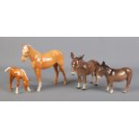 Two Beswick Donkeys, together with two Beswick Palomino horses, H259, and foal. All in good