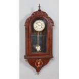 A mahogany and walnut cased wall clock, with carved arched top and 'Greek Key' column detailing.